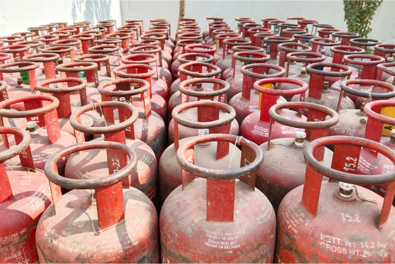 Booking Reminders For LPG Gas Cylinders LPG cylinders in India stack of red cylinders used for storing and distributing liquefied petroleum gas.