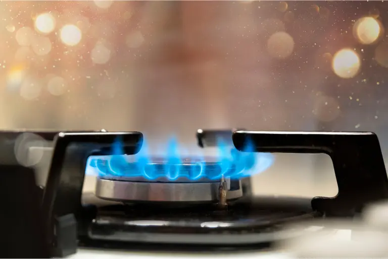 Refill LPG Gas Cylinders Gas stove emitting blue flames representing refill LPG gas cylinder