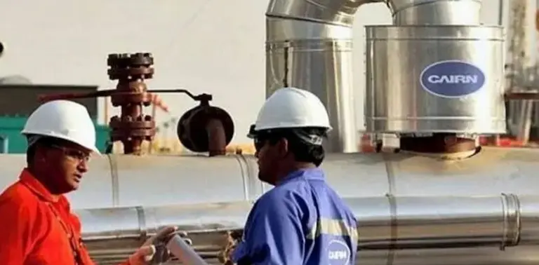 image show of 2 workers in Cairn India