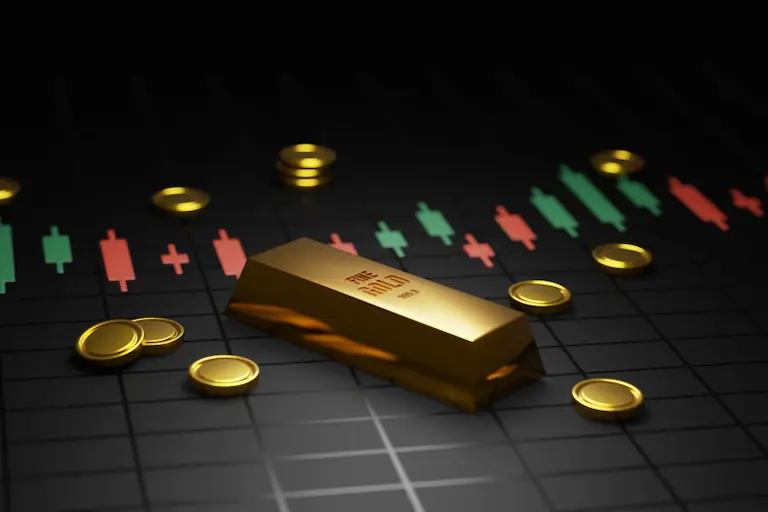 Gold bar is shown with gold coins means influencing gold stock prices 